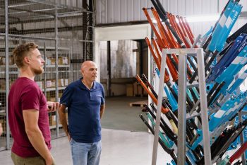 Cyclist's James Spender talking to Factor owner Rob Gitelis in the factory