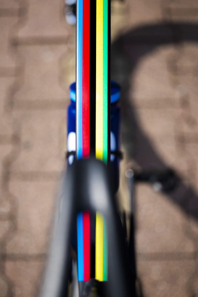 bike top tube from above with UCI rainbow paint